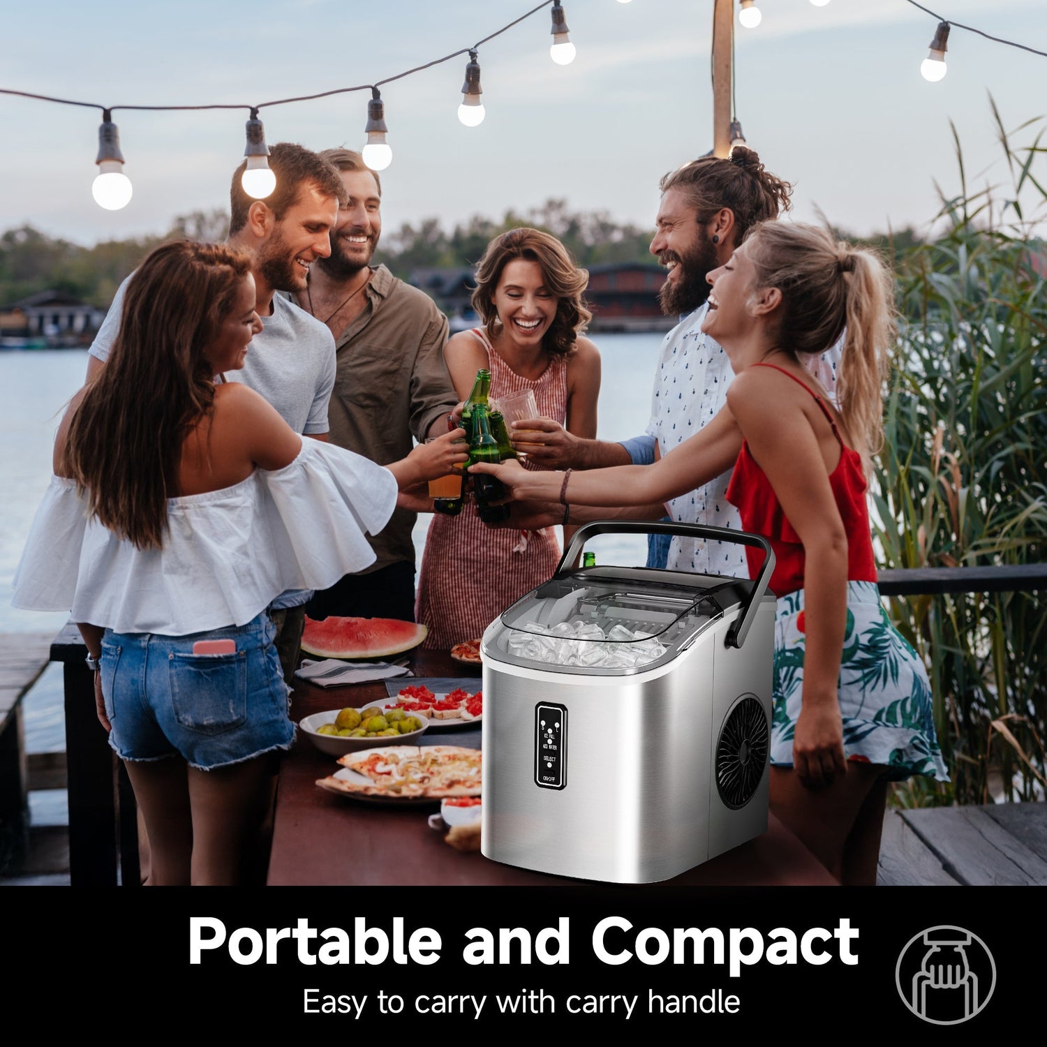 A group of friends toasting with drinks outdoors near a portable and compact ice maker filled with ice.