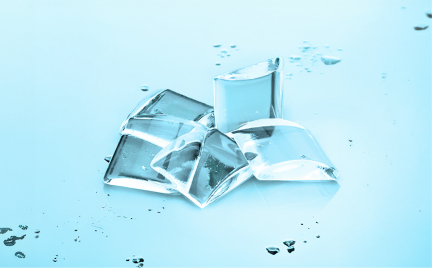 A cluster of crystal-clear ice cubes glistening on a wet, light blue surface.