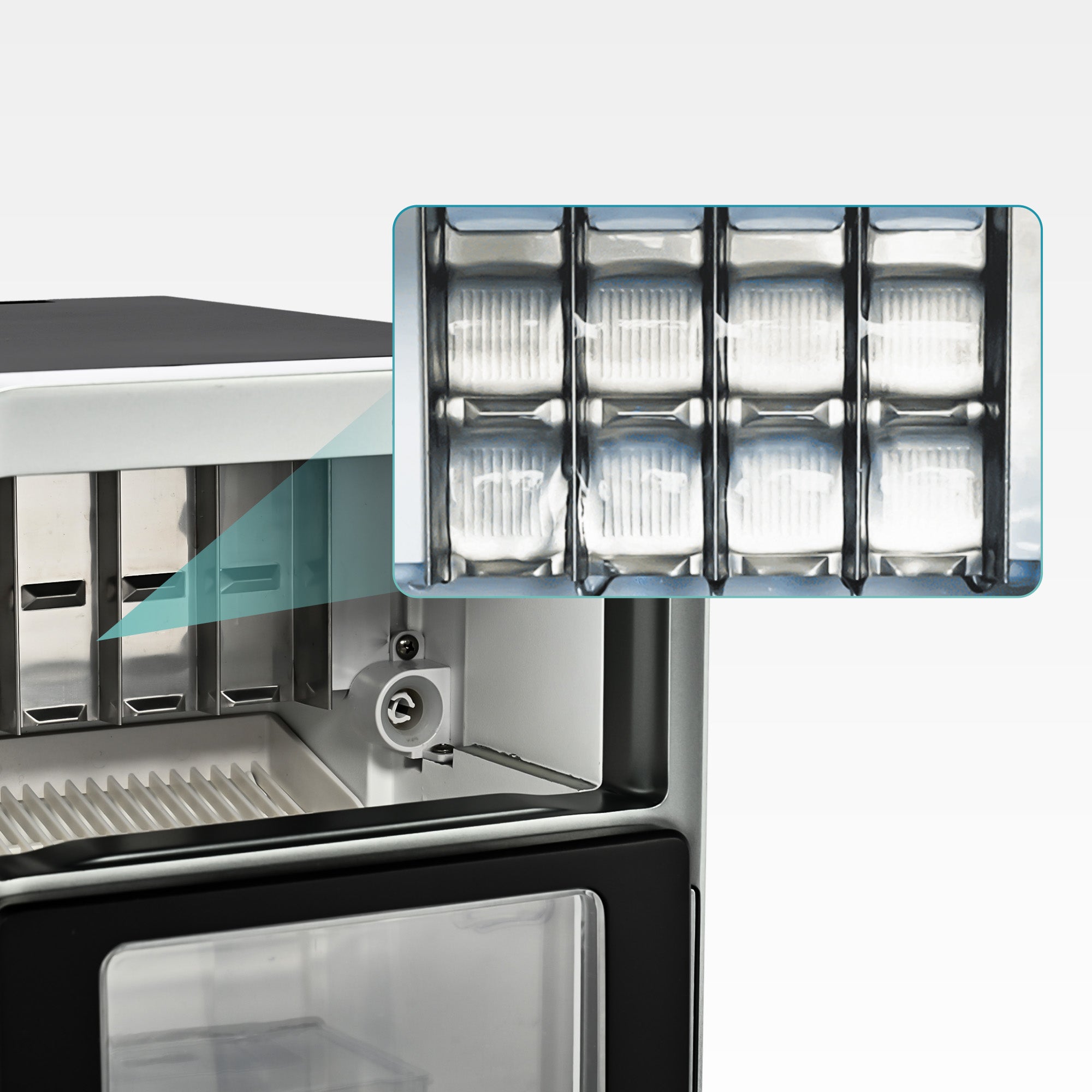 Crescent ice maker interior with clear ice trays and visible ice basket